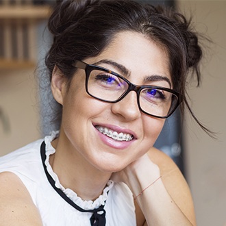 Woman with adult braces smiling