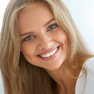 Woman smiling after orthodontic treatment