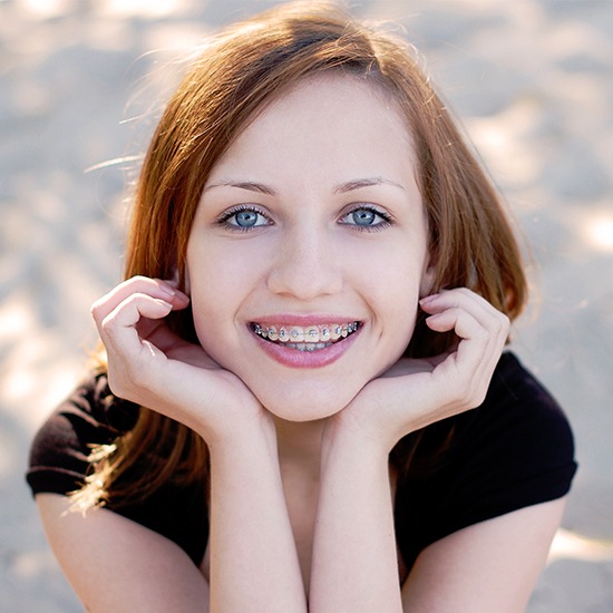 Woman with braces smiling