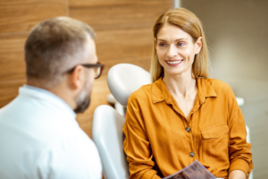 a patient chatting with her orthodontist